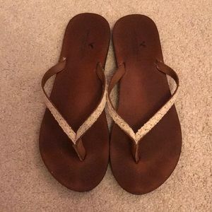 Brown lace flip flops